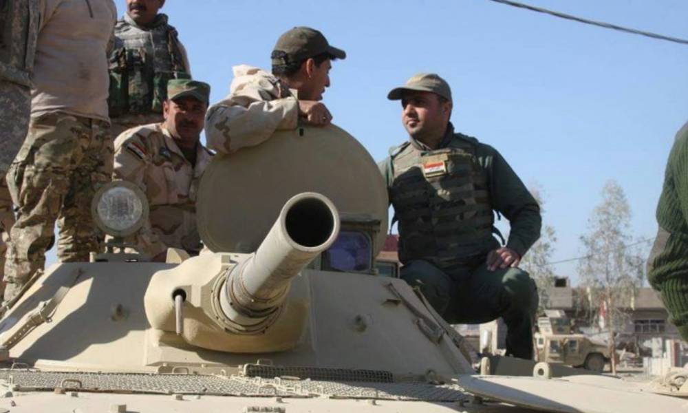 القوات الامنية تحرر سد بادوش وترفع العلم العراقي عليه