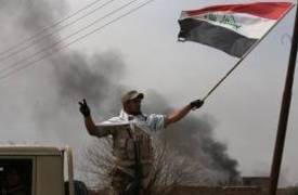 القوات الامنية تحرر قرية كريم خلف وترفع العلم العراقي فوقها