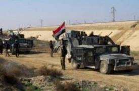 القوات الامنية تحرر قرى الحاج علي السبعة وترفع العلم العراقي فوقها