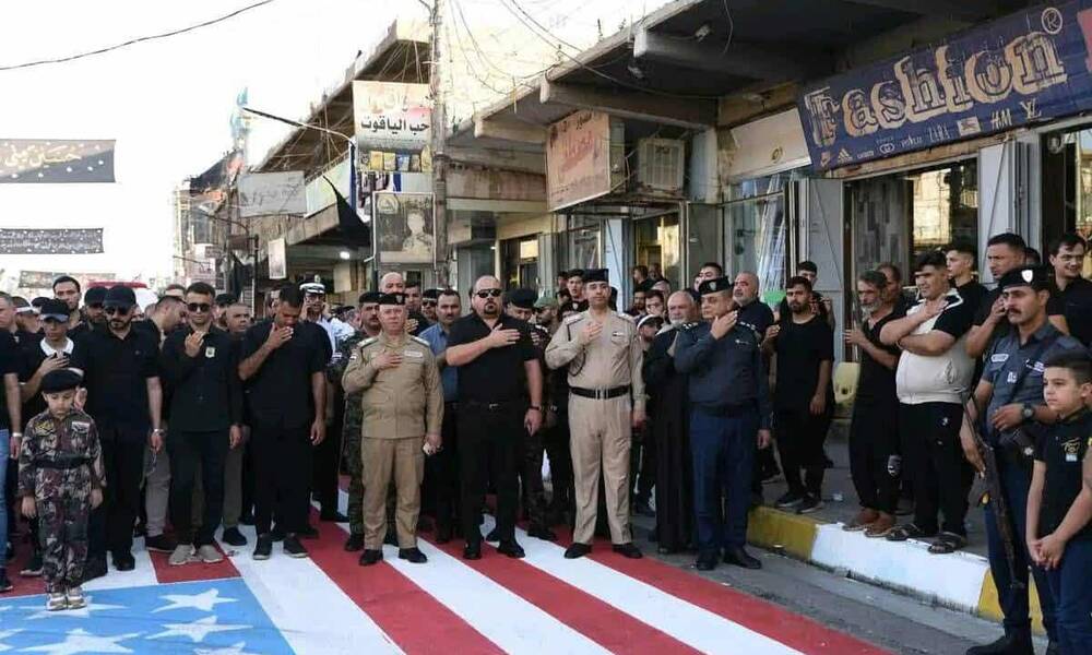 وزير الداخلية يعاقب ضباطاً شاركوا في فعالية تضمنت "دعس" العلم الأمريكي