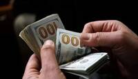 9 عوامل تقف وراء تراجع الدولار في العراق.. ما علاقة سوريا؟