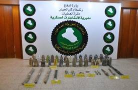 الدفاع تعثر على كدس اسلحة ومتفجرات جنوبي بغداد