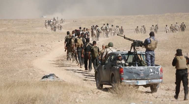 Military forces arrive at the outskirts of Tal Afar in preparation for their liberation
